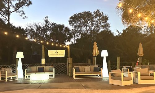 White aluminum frame lounge furniture rental setup in Sarasota, Florida.